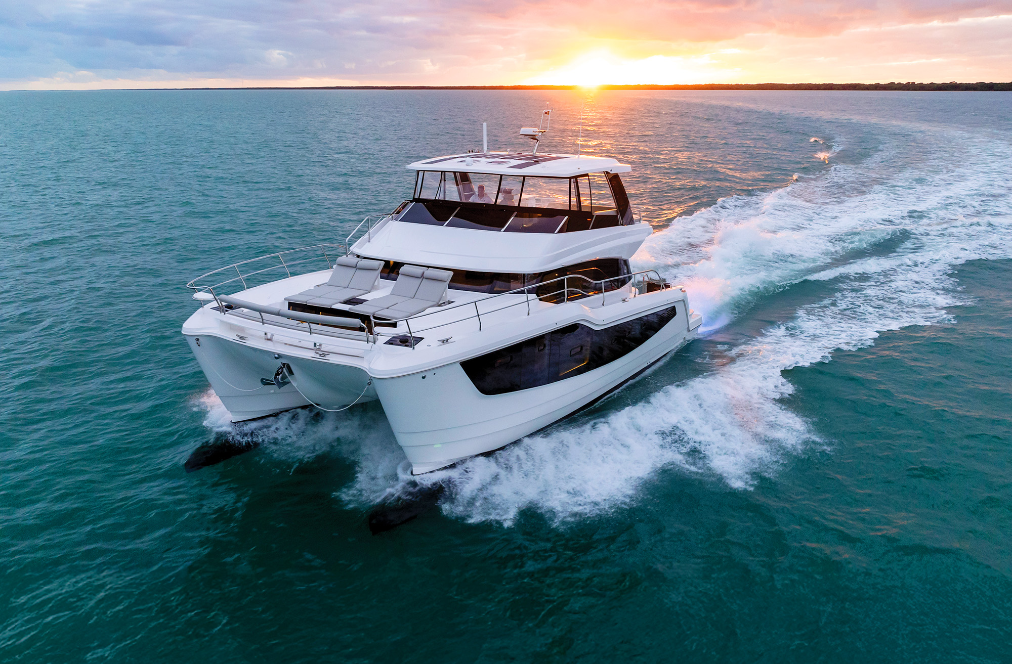 Aquila 50 Yacht cruising at sunset