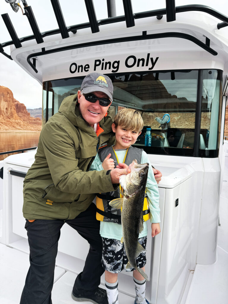 A man and a boy with afish