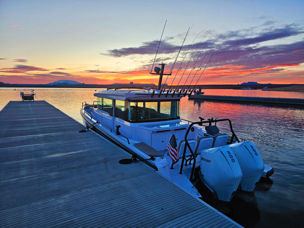 Axopar 37 XC tied to a dock at sunrise