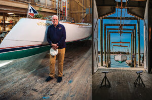 Jim Moores poses in front of one of his boats