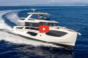 Absolute Navetta 66 running in blue water with mountains in the distance.